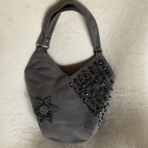 Gray bag hand made and designed with small shiny gray beads and ornaments